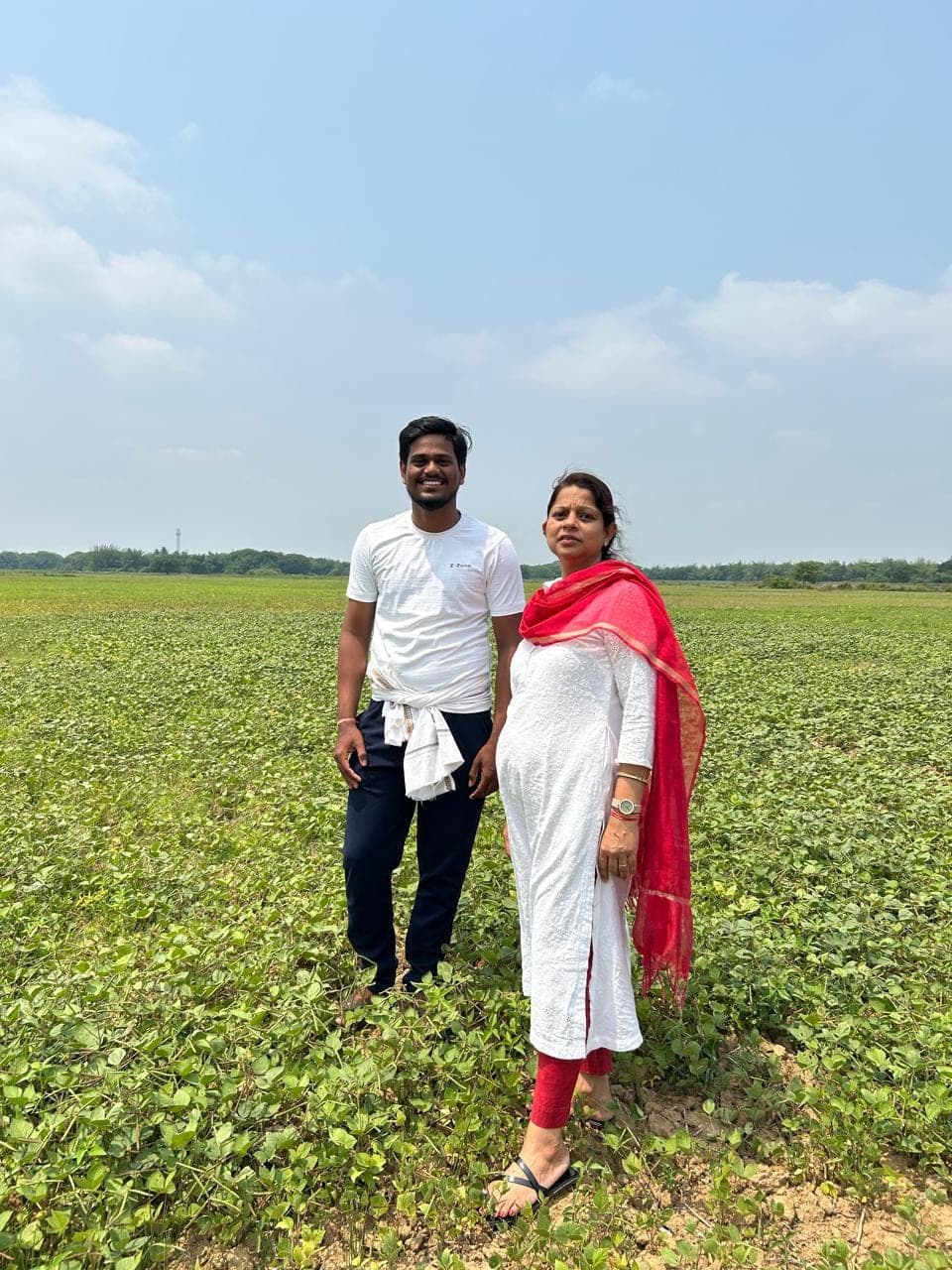 A field visit with producers at the edge of a standing crop
