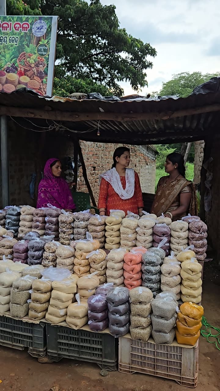 A village producer collective stall stacked with graded produce
