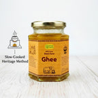 Mye Farm 100% pure desi cow ghee in glass jar, prepared using a slow-cooked traditional heritage method, showcasing golden handmade ghee on a clean wooden background