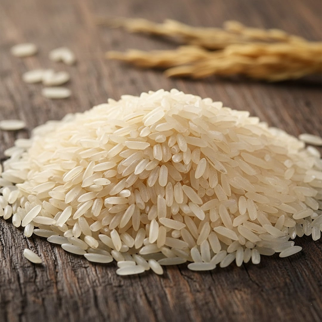Close-up macro shot of Mye Farm Telangana Sona Rice raw grains piled on a rustic wooden surface, emphasizing the natural, unpolished texture and creamy white color of the low GI rice.